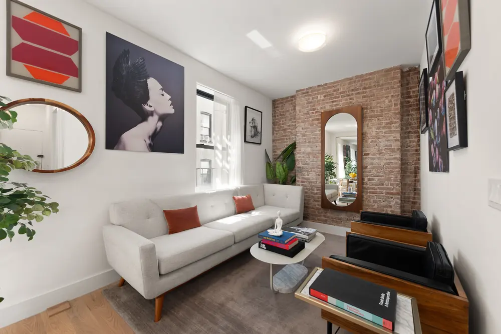 80 Charles Street, Residence 3R: the living room from the opposite corner, showing the seating and window wall