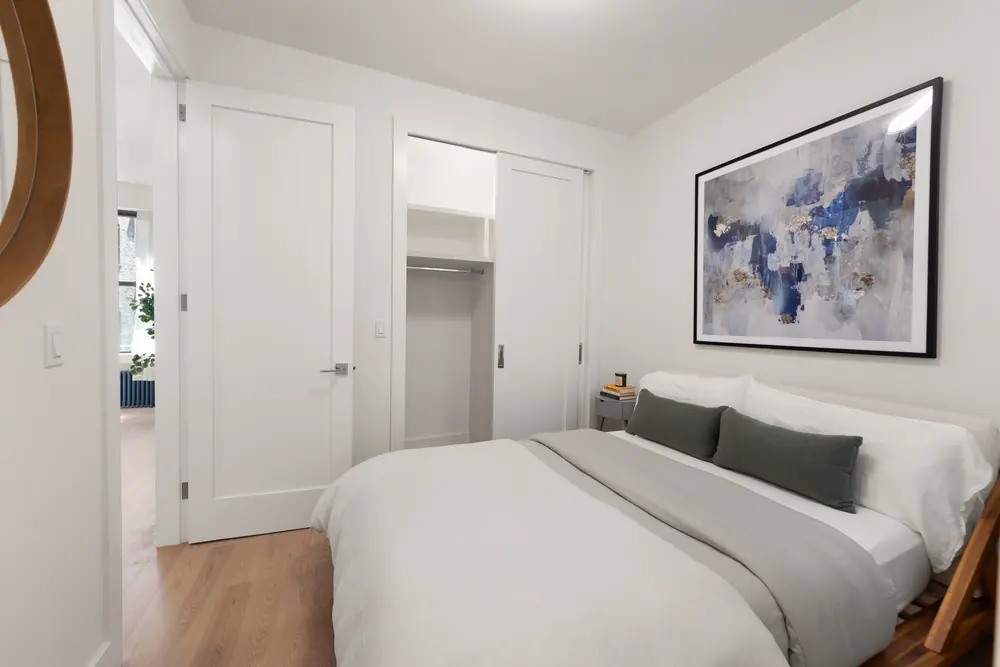 80 Charles Street, Residence 3R: the bedroom in soft neutrals with a single framed abstract