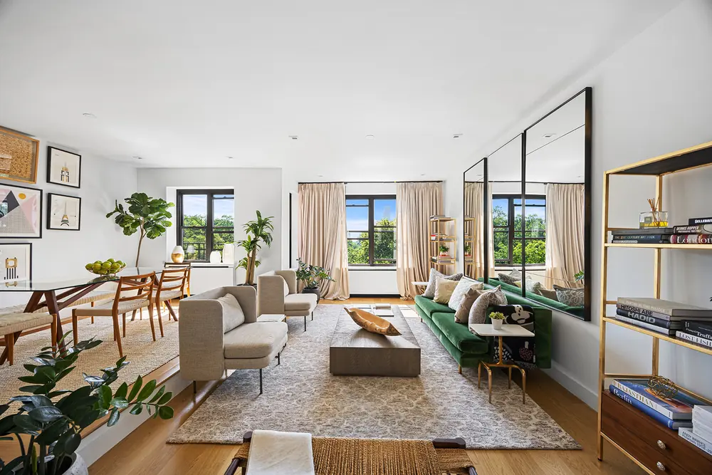 425 Central Park West, Residence 7CD: living room and dining area with a green banquette and park views